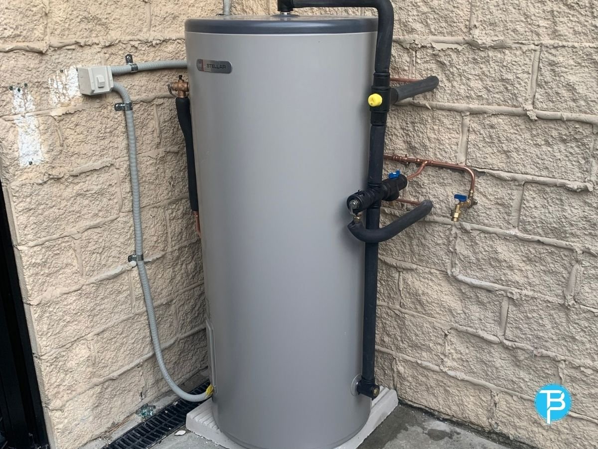 MCJ Hot Water Installation and Repairs technician working on a hot water unit