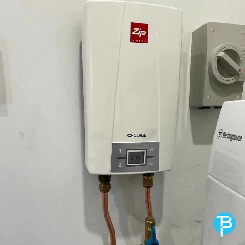Technician repairing a hot water system