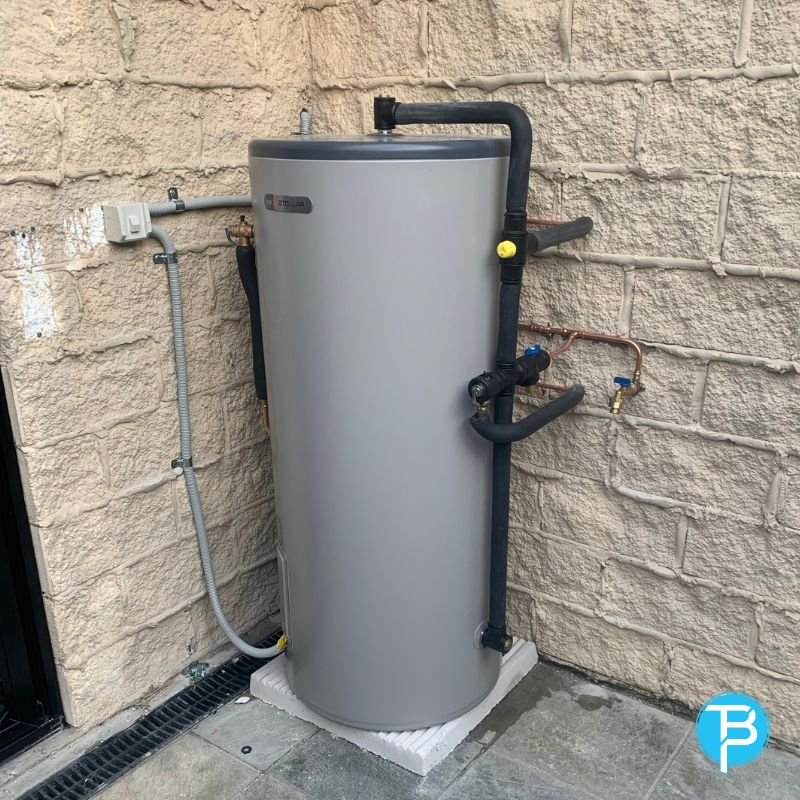 Heat pump hot water unit outside a home